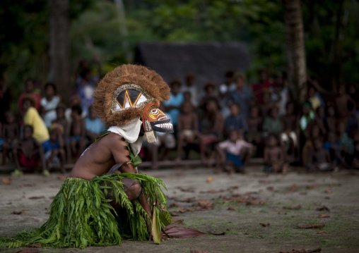 Malagan tatuana masks dance during a funeral ceremony, New Ireland Province, Langania, Papua New Guinea