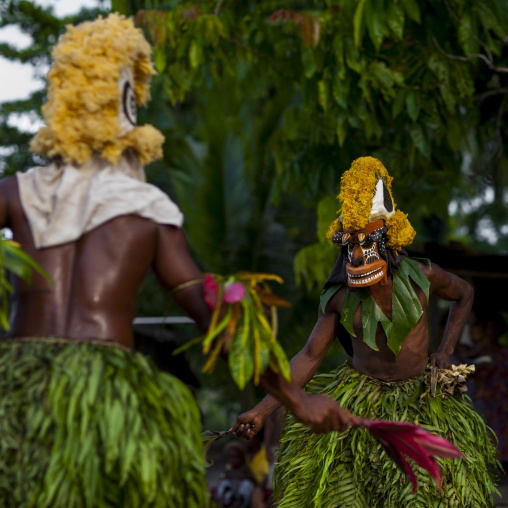 Malagan tatuana masks dance during a funeral ceremony, New Ireland Province, Langania, Papua New Guinea
