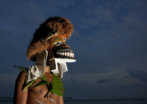 Malagan tatuana masks dance during a funeral ceremony, New Ireland Province, Langania, Papua New Guinea