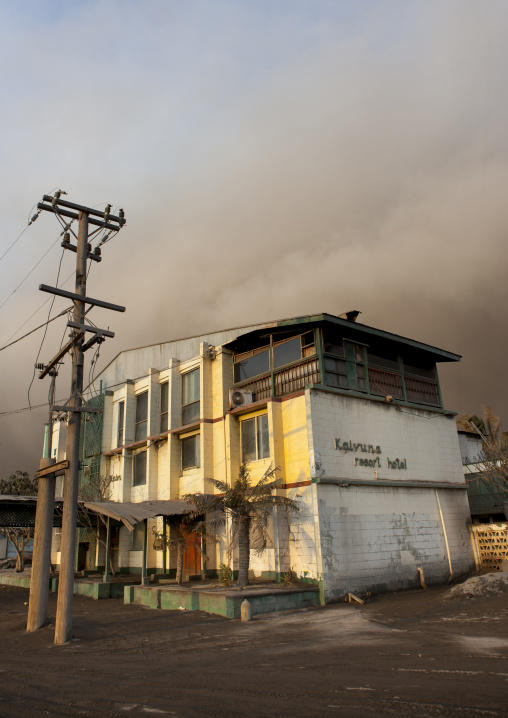 House under a volcanic eruption in tavurvur volcano, East New Britain Province, Rabaul, Papua New Guinea