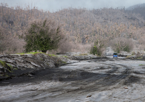 Car under a volcanic eruption in tavurvur volcano, East New Britain Province, Rabaul, Papua New Guinea