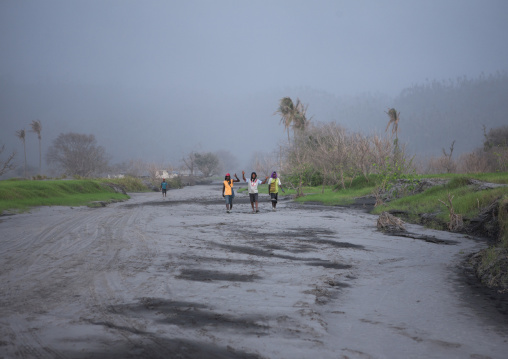 Men waliking in ashes, East New Britain Province, Rabaul, Papua New Guinea