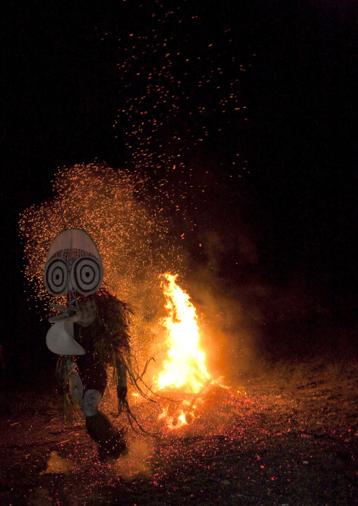 Dancer with a giant mask during a Baining tribe fire dance, East New Britain Province, Rabaul, Papua New Guinea
