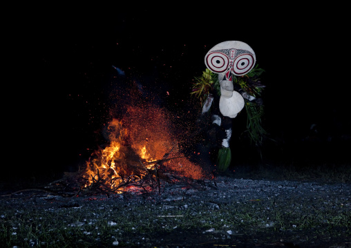 Dancer with a giant mask during a Baining tribe fire dance, East New Britain Province, Rabaul, Papua New Guinea