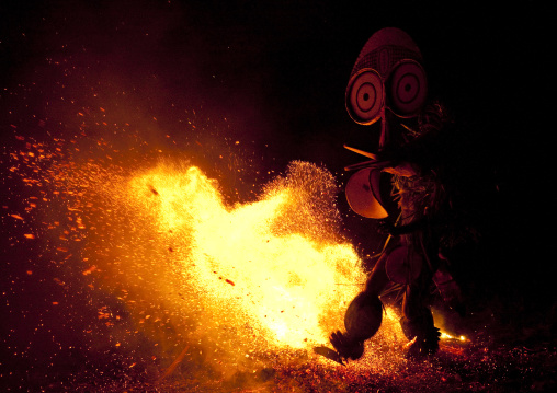 Dancer with a giant mask during a Baining tribe fire ceremony, East New Britain Province, Rabaul, Papua New Guinea