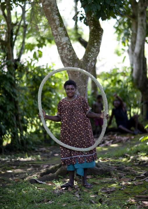Woman holding a giant shell money, East New Britain Province, Rabaul, Papua New Guinea