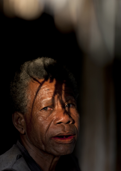 Portrait of an islander woman in the sunset, Milne Bay Province, Trobriand Island, Papua New Guinea
