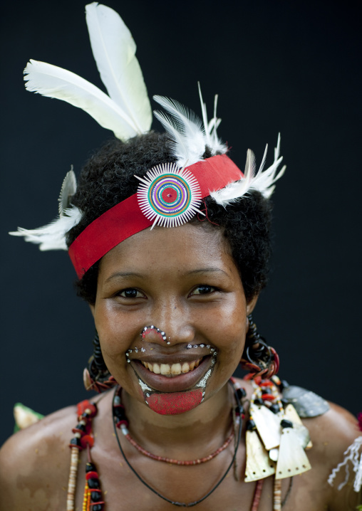 Portrait of a smiling tribal woman in traditional clothing, Milne Bay Province, Trobriand Island, Papua New Guinea