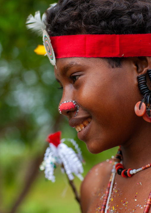 Portrait of a smiling tribal woman in traditional clothing, Milne Bay Province, Trobriand Island, Papua New Guinea