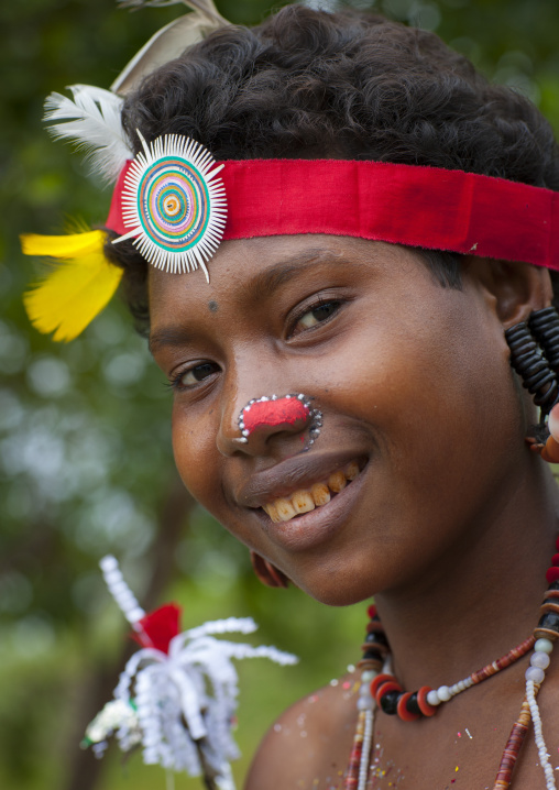 Portrait of a smiling tribal woman in traditional clothing, Milne Bay Province, Trobriand Island, Papua New Guinea