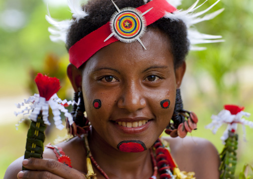 Portrait of a smiling tribal woman in traditional clothing, Milne Bay Province, Trobriand Island, Papua New Guinea