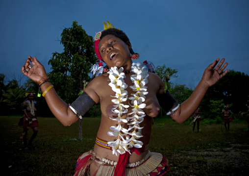 Portrait of a topless tribal woman in traditional clothing, Milne Bay Province, Trobriand Island, Papua New Guinea