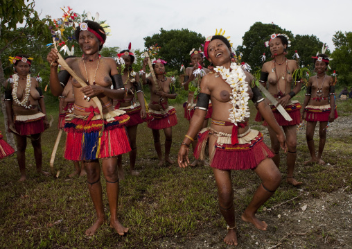Tribal dancers in traditional clothing during a sing-sing, Milne Bay Province, Trobriand Island, Papua New Guinea