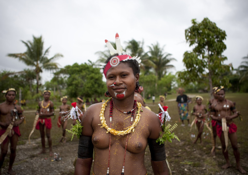 Tribal dancers in traditional clothing during a sing-sing, Milne Bay Province, Trobriand Island, Papua New Guinea