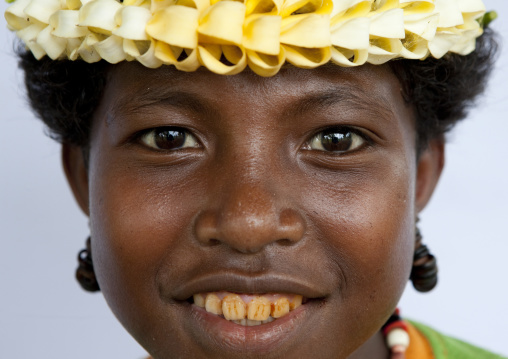 Smiling girl with flowers in the hair, Milne Bay Province, Trobriand Island, Papua New Guinea