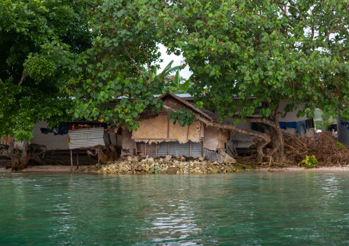 Protection against rising sea levels in a costal village, Autonomous Region of Bougainville, Bougainville, Papua New Guinea