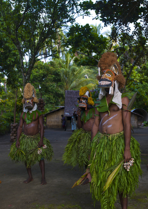 Malagan tatuana masks dance during a funeral ceremony, New Ireland Province, Langania, Papua New Guinea