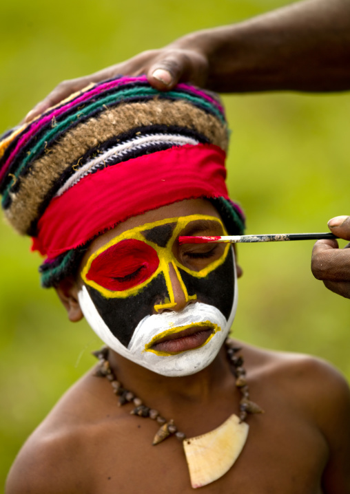 Boy having traditonal makeup before a Sing-sing ceremony, Western Highlands Province, Mount Hagen, Papua New Guinea