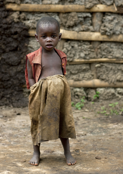Batwa tribe boy with hands in his pockets, Western Province, Cyamudongo, Rwanda