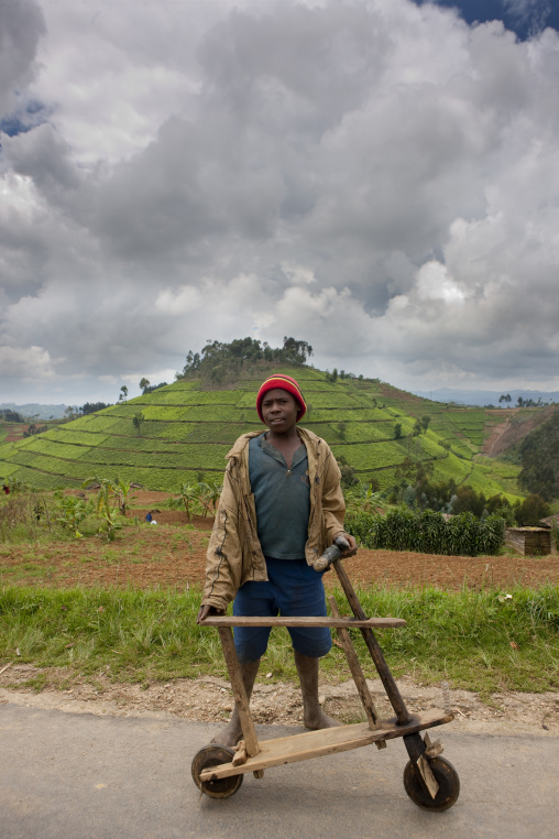 Rwandan boy with a wooden bicycle, Nyungwe Forest National Park, Gisakura, Rwanda