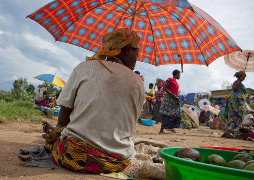 Rwandan woman selling avocados in a market, Kigali Province, Kigali, Rwanda