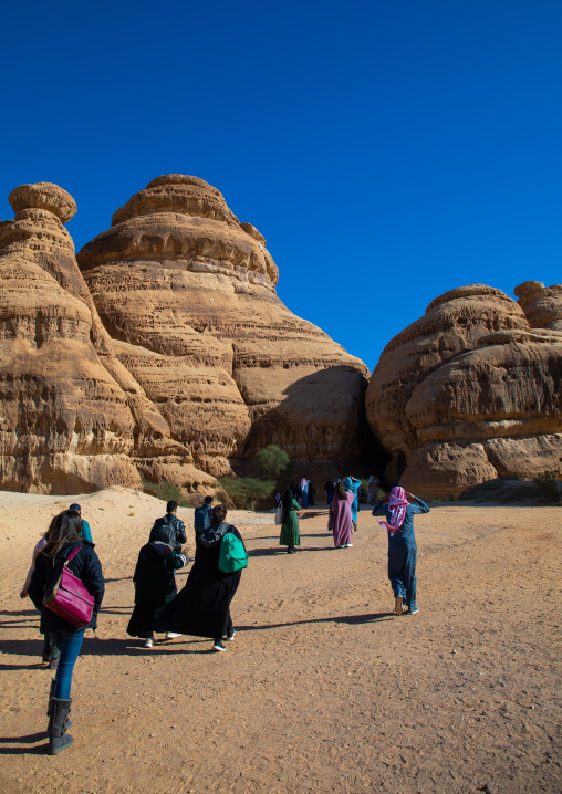 Tourists in al-Diwan in jebel Ithlib, Al Madinah Province, Alula, Saudi Arabia