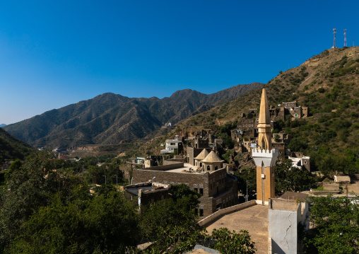 Multi-storey houses made of stones and mosque , Asir province, Rijal Alma, Saudi Arabia