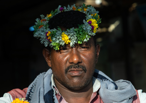 Portrait of a flower man wearing a floral crown on the head, Jizan province, Sabya, Saudi Arabia