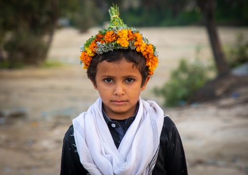 Portrait of a flower boy wearing a floral crown on the head, Jizan province, Alaydabi, Saudi Arabia