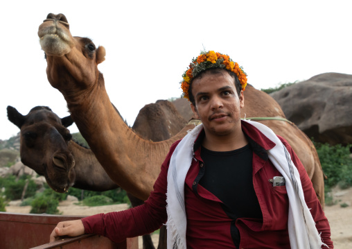 Portrait of a saudi flower man with camels, Jizan province, Alaydabi, Saudi Arabia