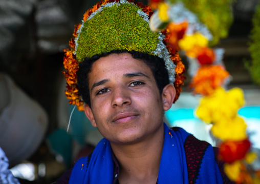 Portrait of a flower man wearing a floral crown on the head, Jizan province, Addayer, Saudi Arabia