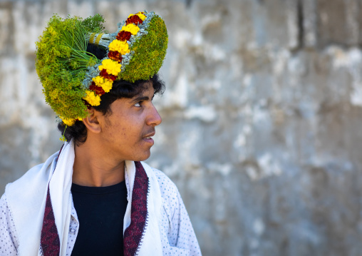 Portrait of a flower man wearing a floral crown on the head, Jizan province, Addayer, Saudi Arabia