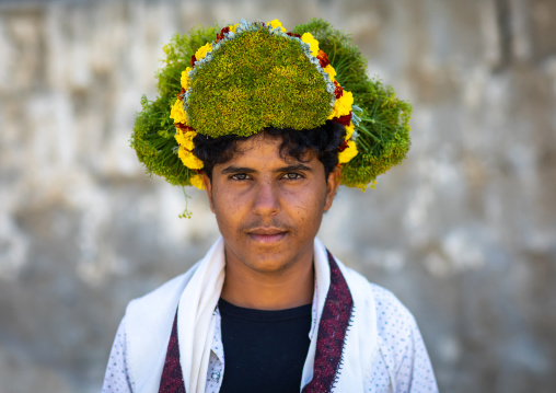 Portrait of a flower man wearing a floral crown on the head, Jizan province, Addayer, Saudi Arabia