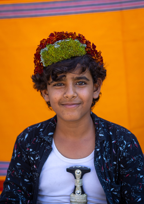 Portrait of a flower boy wearing a floral crown on the head, Jizan province, Addayer, Saudi Arabia