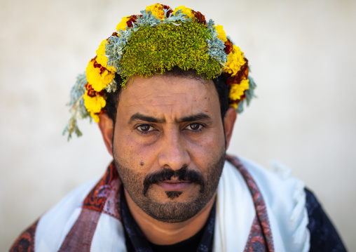 Portrait of a flower man wearing a floral crown on the head, Jizan province, Addayer, Saudi Arabia