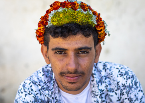 Portrait of a flower man wearing a floral crown on the head, Jizan province, Addayer, Saudi Arabia