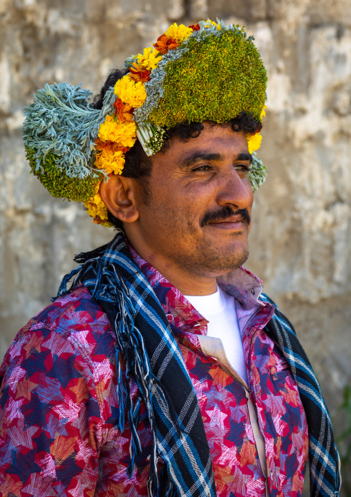 Portrait of a flower man wearing a floral crown on the head, Jizan province, Addayer, Saudi Arabia
