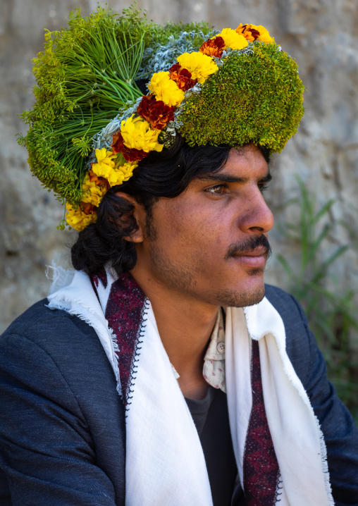 Portrait of a flower man wearing a floral crown on the head, Jizan province, Addayer, Saudi Arabia