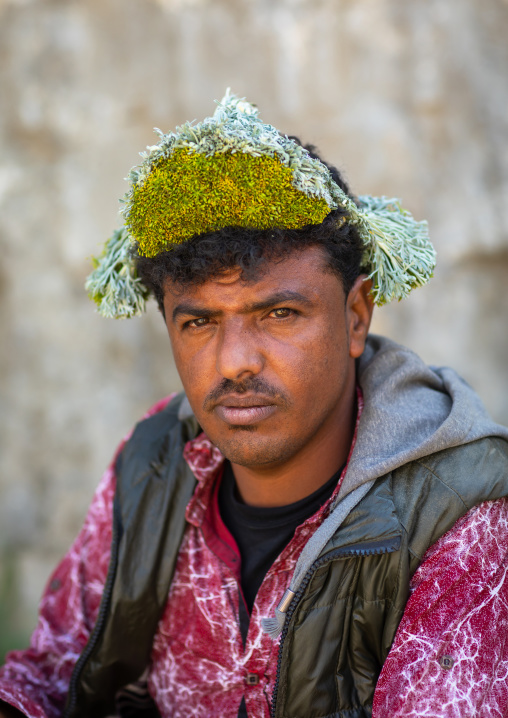 Portrait of a flower man wearing a floral crown on the head, Jizan province, Addayer, Saudi Arabia