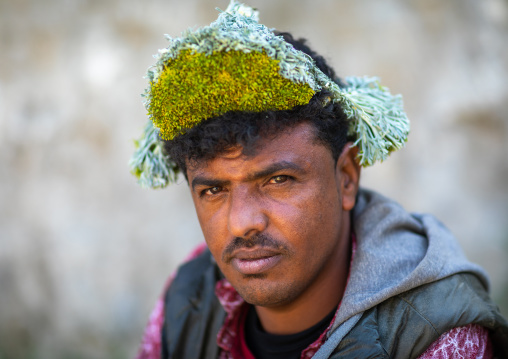 Portrait of a flower man wearing a floral crown on the head, Jizan province, Addayer, Saudi Arabia