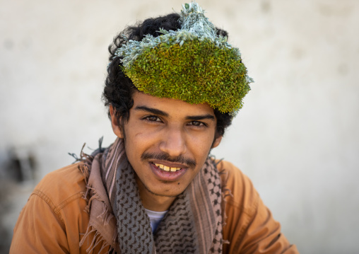 Portrait of a flower man wearing a floral crown on the head, Jizan province, Addayer, Saudi Arabia