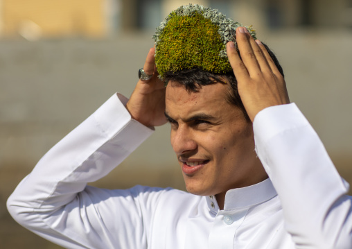 Portrait of a flower man wearing a floral crown on the head, Jizan province, Addayer, Saudi Arabia