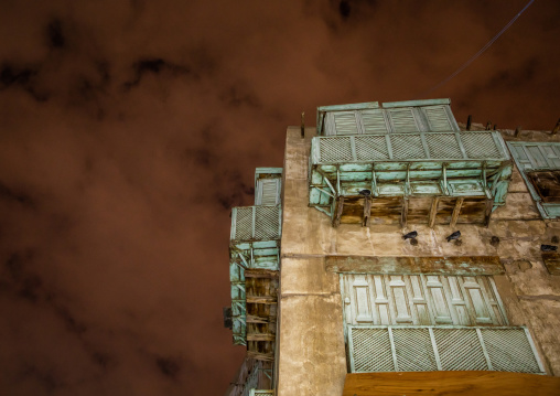 Historic house with wooden mashrabiyas in al-Balad quarter at night, Mecca province, Jeddah, Saudi Arabia