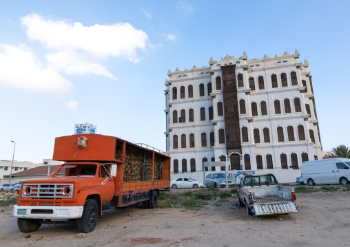 Red truck with hives inside in front of Shubra palace, Mecca province, Taïf, Saudi Arabia