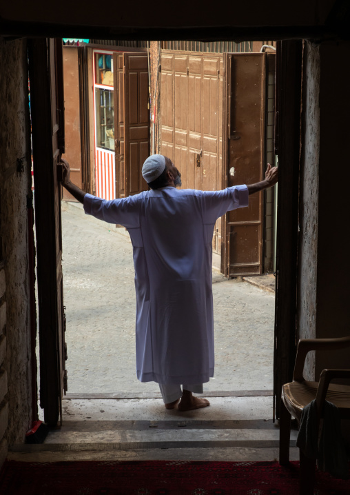 Saudi man standing at the entrance of abdullah matbouli house, Mecca province, Jeddah, Saudi Arabia