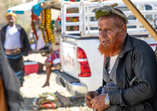 Portrait of a flower man with a red beard wearing a floral crown on the head, Jizan Province, Addayer, Saudi Arabia