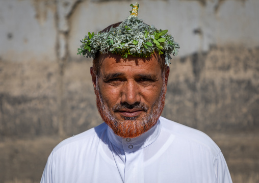 Portrait of a flower man wearing a floral crown on the head, Jizan Province, Addayer, Saudi Arabia