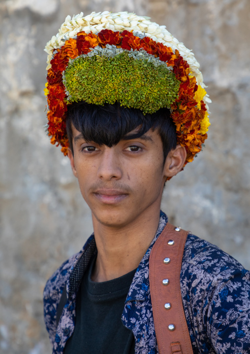 Portrait of a flower young man wearing a floral crown on the head, Jizan Province, Addayer, Saudi Arabia