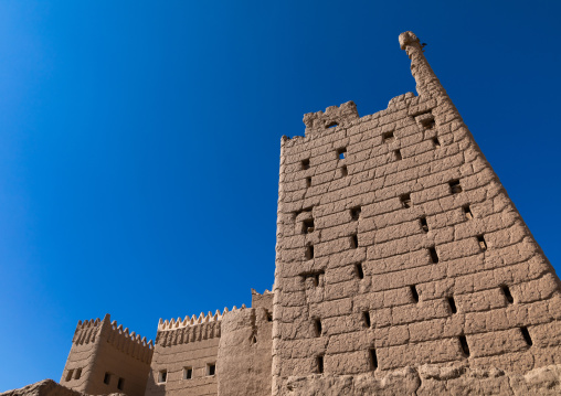 Traditional old mud house against blue sky, Najran Province, Najran, Saudi Arabia