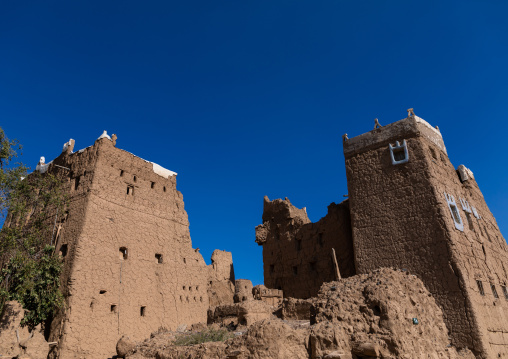 Old village of traditional mud houses against blue sky, Asir province, Dhahran Al Janub, Saudi Arabia
